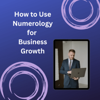 Man in business attire using a laptop, symbolising the application of numerology for business growth.